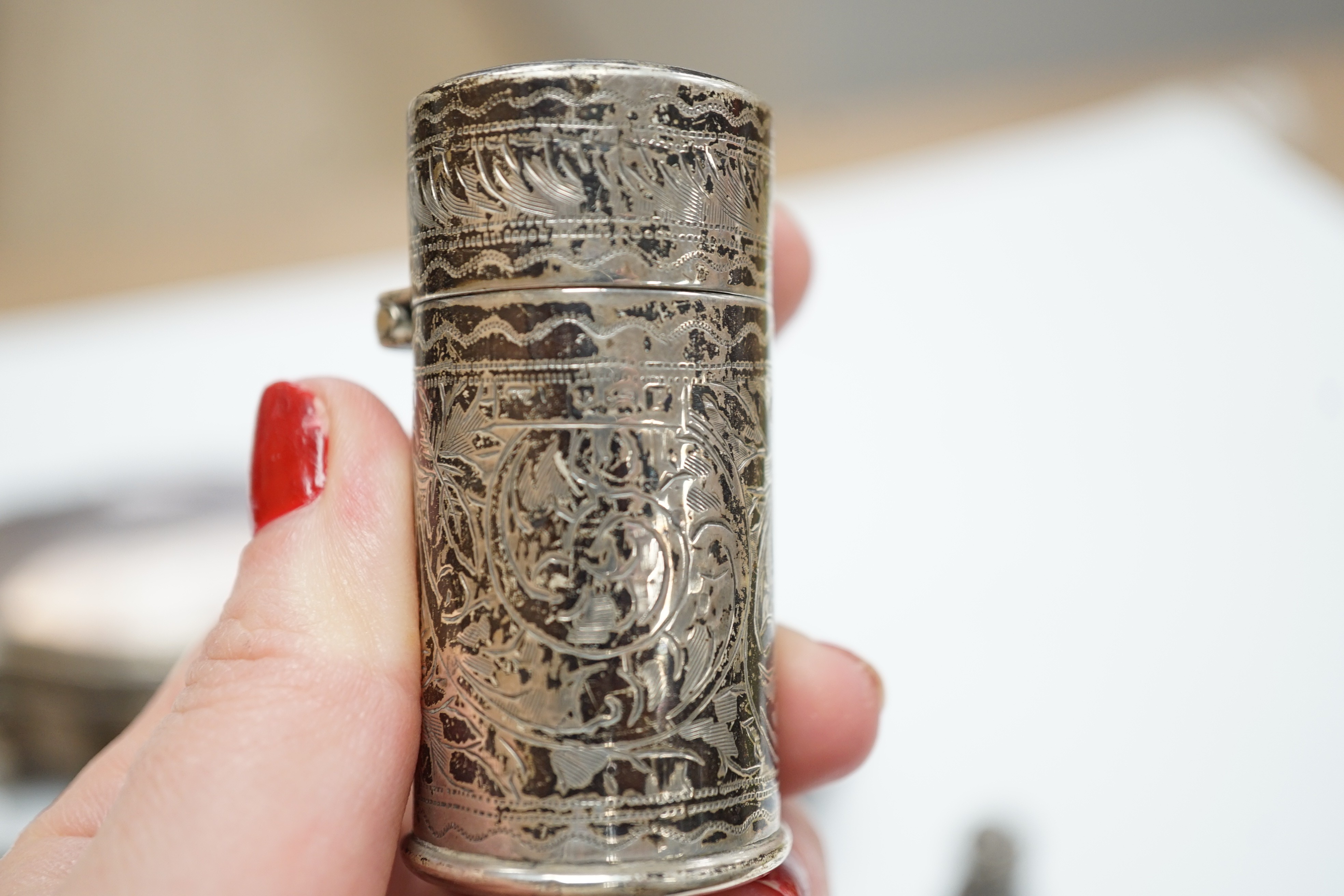 A George V silver mounted trinket box, Elkington & Co, Birmingham, 1918, 13.1cm, a silver mustard pot, two Scandinavian 925 condiments, two silver mounted scent bottles, hatpins and hatpin stand and a silver mounted thre